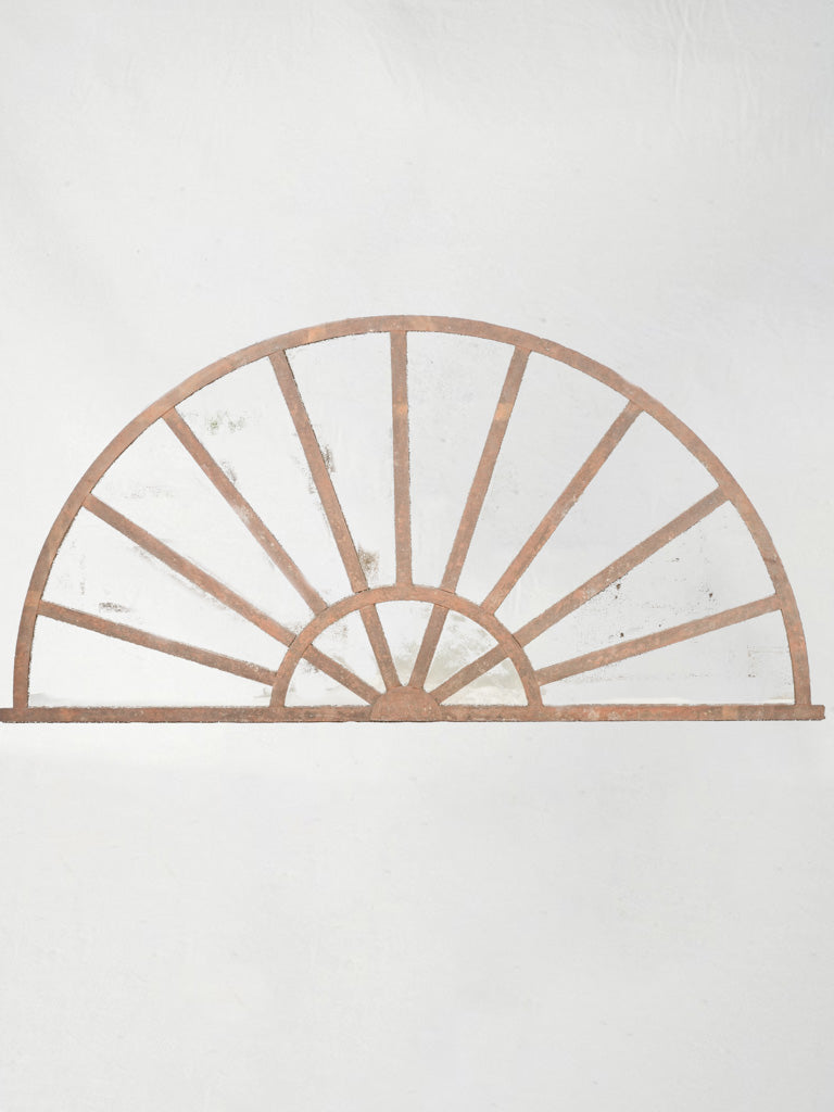 Aged industrial iron transom mirror  