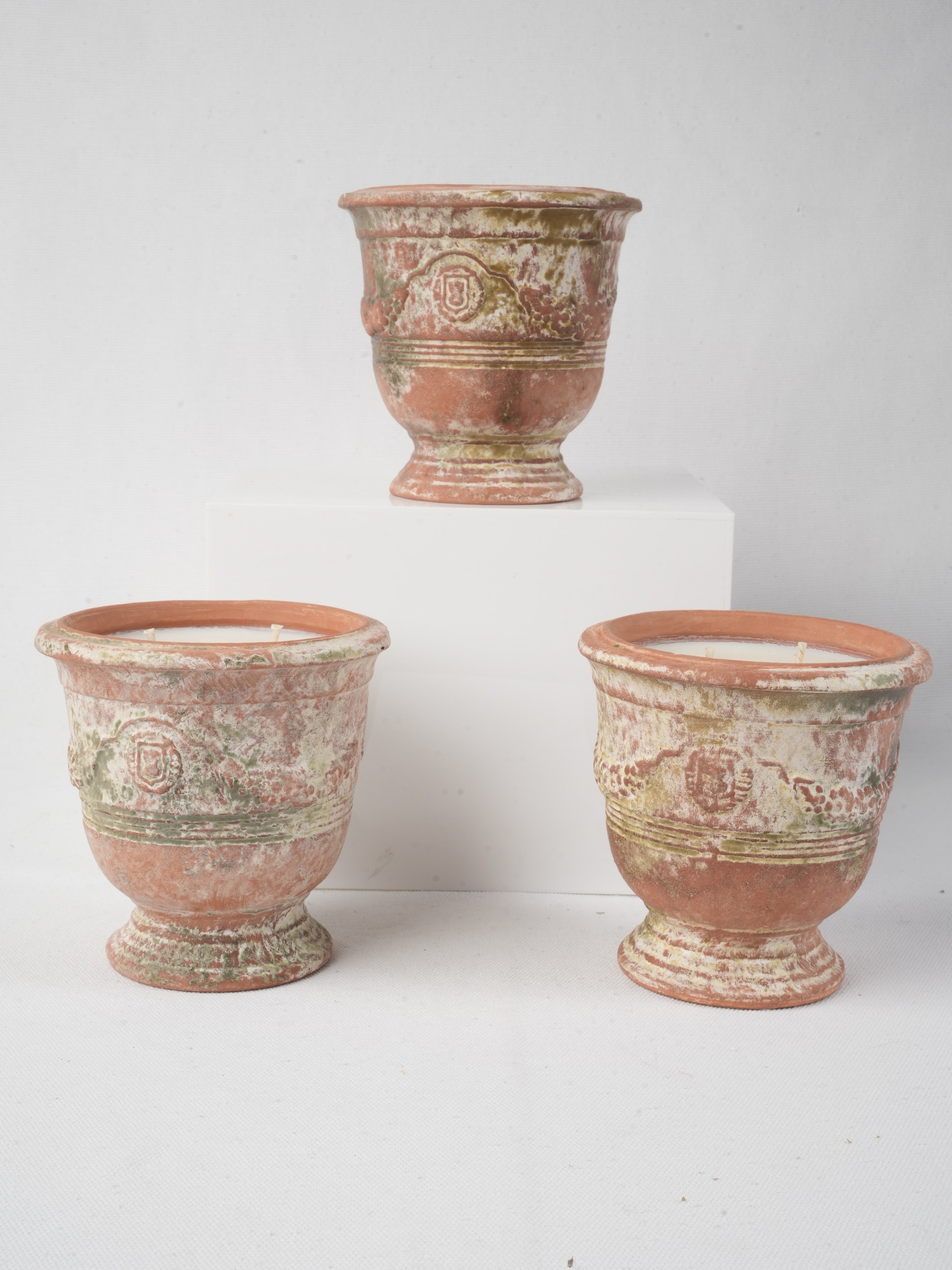 Charming rustic terracotta candle pots  