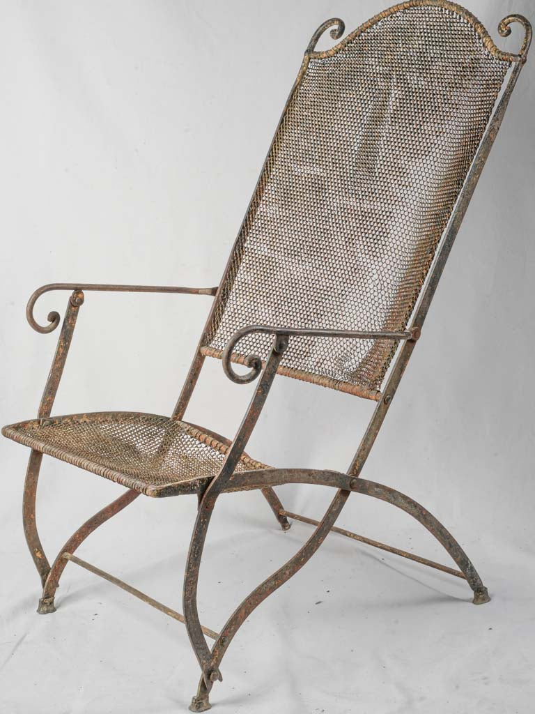 Elegant aged French garden armchair
