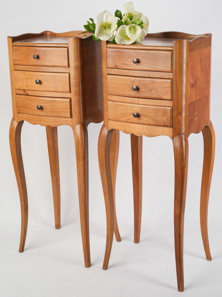 Vintage warm-toned fruitwood nightstands  